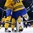 BUFFALO, NEW YORK - JANUARY 4: Sweden's Filip Gustavsson #30 is joined in the crease by his teammates following their victory over USA during the semi-final round of the 2018 IIHF World Junior Championship. (Photo by Andrea Cardin/HHOF-IIHF Images)

